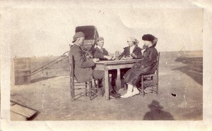 two couples sitting at table outside