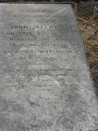 log cabin and gravesite